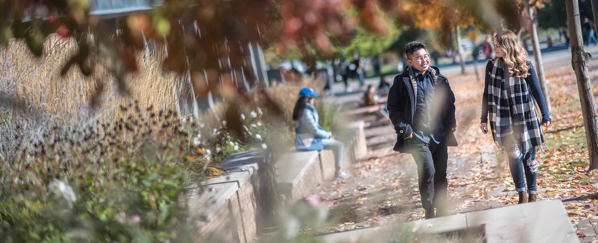 Student walking outdoors on the UBC Okanagan Campus